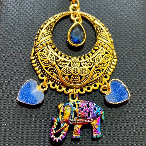 Source Unknown Jewelry - Heavy gold elephant pendant with blue dangling hearts